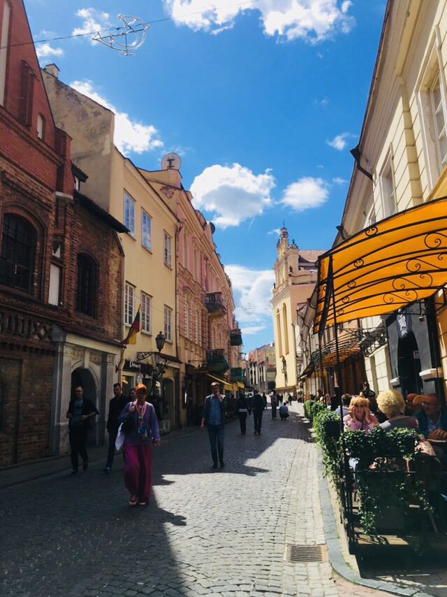 Indre strolling through the quaint old town streets of Vilnius in Lithuania